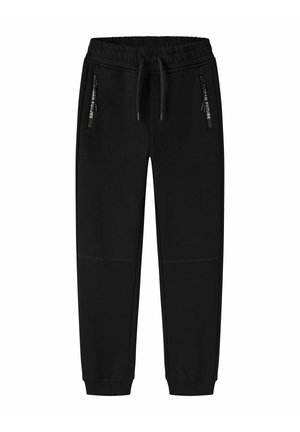 Pantalon de jogging noir avec taille élastique et cordons, avec poches zippées portant le texte "Urban Future" sur les curseurs.