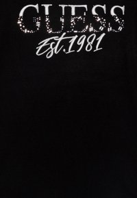 Guess Stickad tröja - jet black
