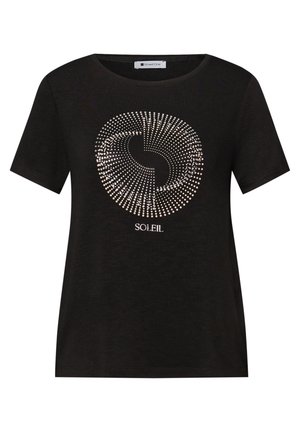 Chemise noire à manches courtes avec un motif circulaire métallique et le mot "SOLEIL" imprimé sous le design à l'avant.