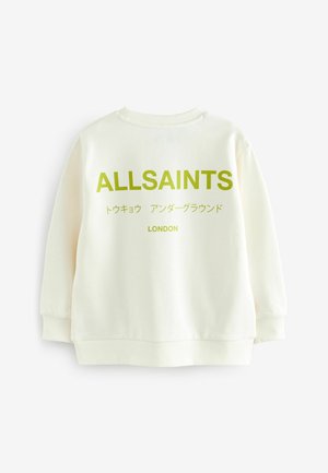 Krämfärgad sweatshirt med rund halsringning och lös passform. Har djärv grön "ALLSAINTS" text och japanska tecken på framsidan.
