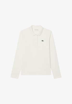 Polo shirt blanc à manches longues en coton, avec un col classique, une patte de boutonnage à trois boutons et un logo crocodile brodé vert sur la poitrine.