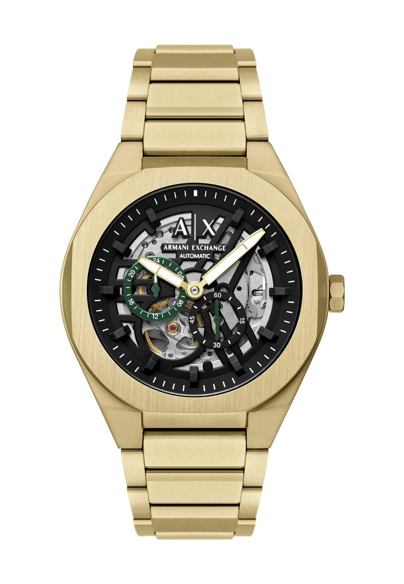 Złoty zegarek na rękę Armani Exchange z odsłoniętym czarnym i srebrnym automatycznym mechanizmem, podzielonymi na mniejsze tarcze z zielonymi akcentami oraz bransoletą z metalowych ogniw.