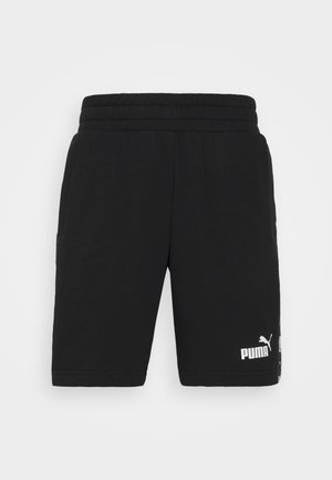 Shorts in cotone neri con elastico in vita. Presentano tasche laterali e il logo bianco Puma sulla gamba sinistra in basso. Design atletico classico.
