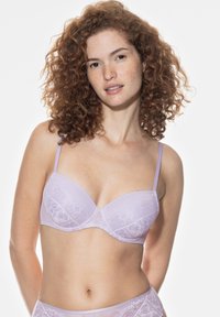 Lilac lace bra with padded, underwire cups and adjustable straps; features intricate lace detailing and a smooth fabric finish.