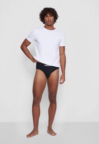 Levi's® MEN SOLID BASIC BRIEF 4 PACK - Kalhotky - black