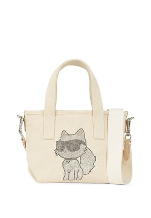 Kremfarget canvas totebag med en kattgrafikk laget av svarte edelstener. Har to håndtak og en avtagbar skulderreim.