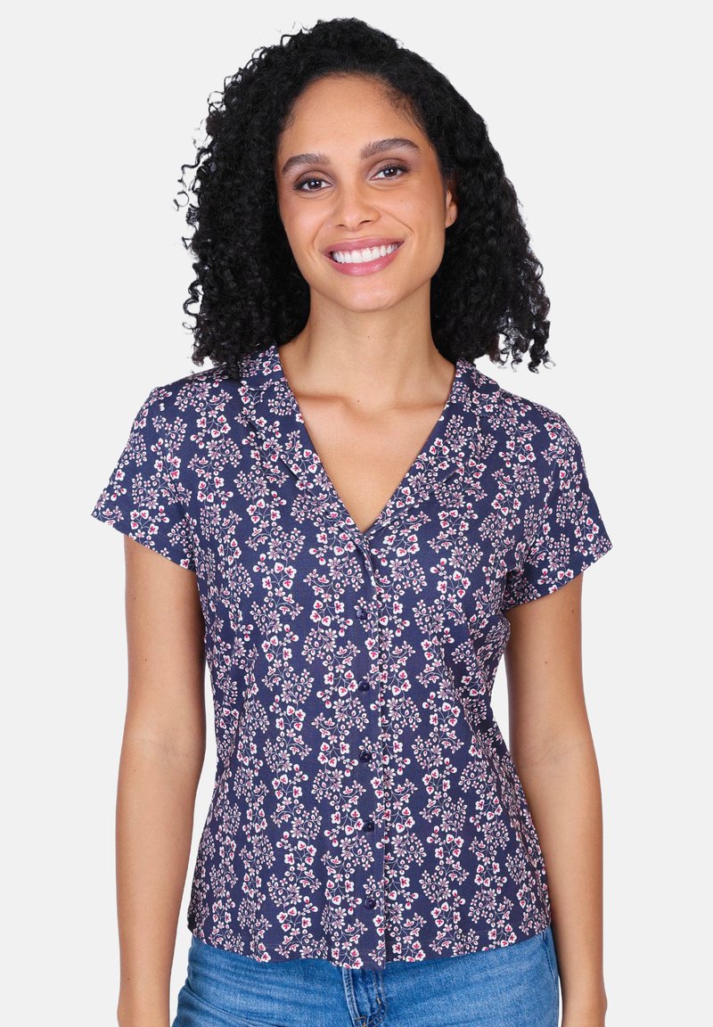 Navy button-up blouse with short sleeves, floral pattern in pink and white, tailored fit, lightweight fabric, and a notched collar.