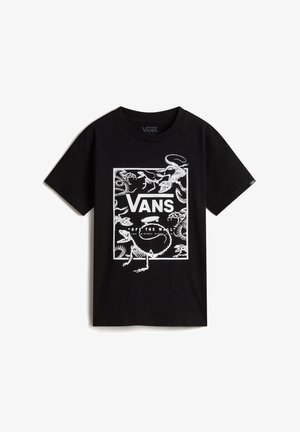 T-shirt Vans noir avec un graphisme rectangulaire blanc représentant des squelettes de dinosaures, le logo Vans centré au-dessus du texte "Off The Wall".