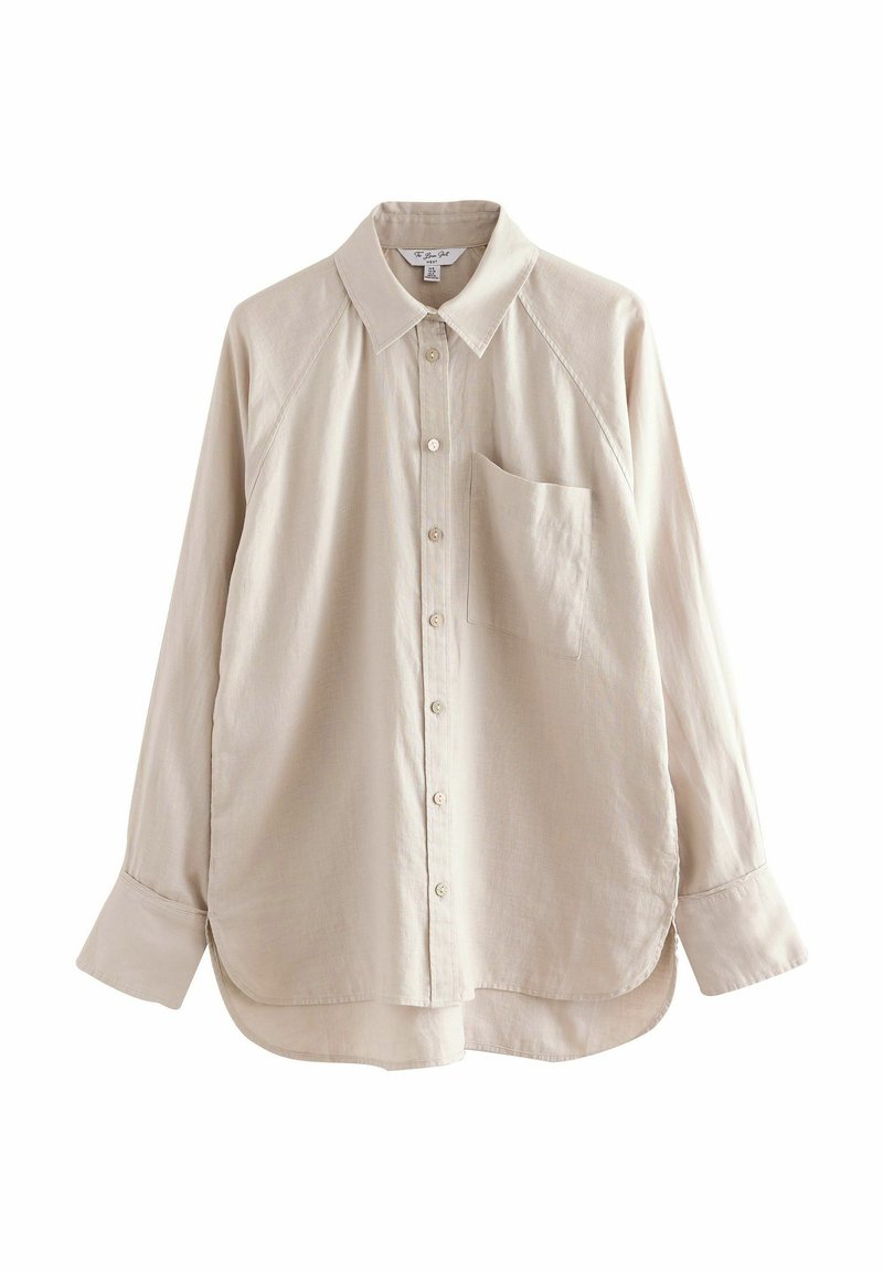 Light beige long-sleeve shirt with a button-down collar, single chest pocket, and curved hem. Made of soft fabric with a smooth texture.