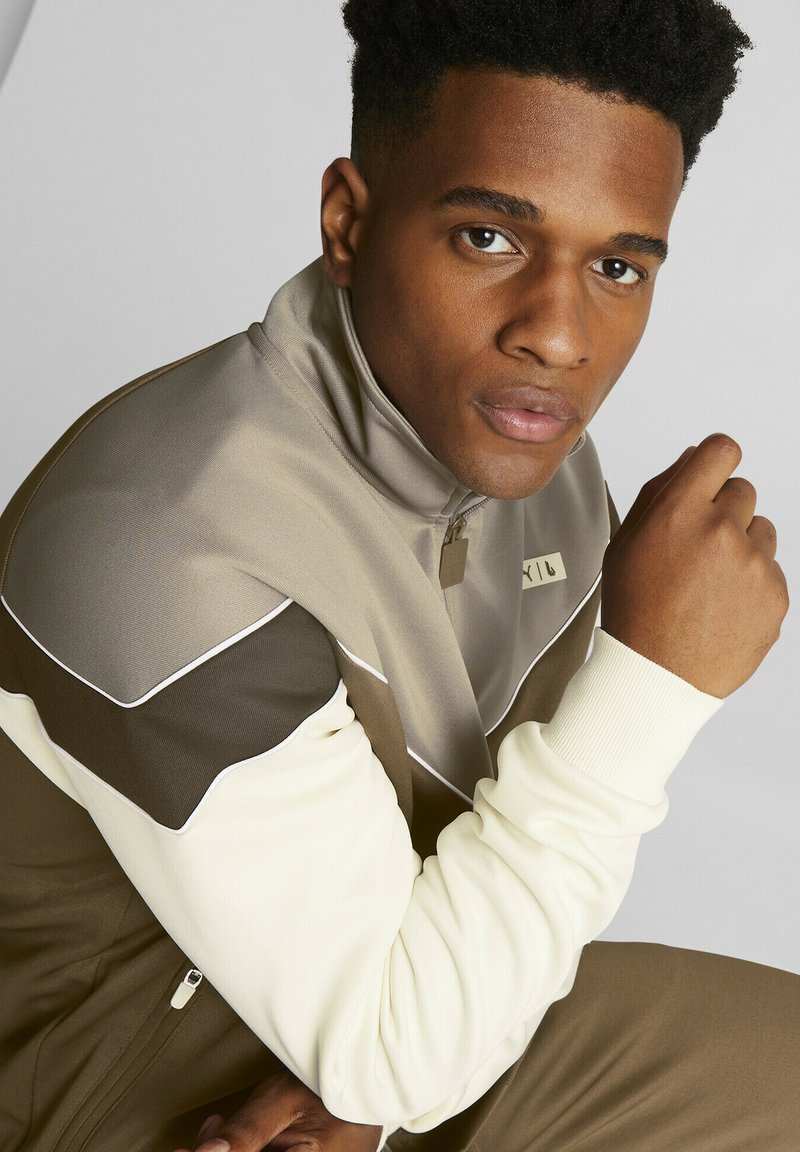 survetement puma marron