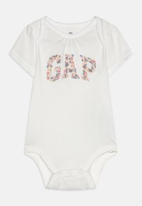 Body de mangas curtas brancas com bordado floral "GAP". Material em algodão suave, decote redondo e fecho de pressão na parte inferior.