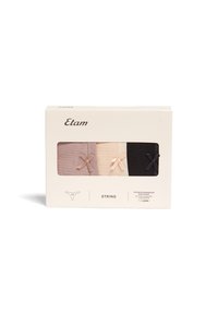 Lot de trois strings en rose clair, beige et noir, fabriqués en coton doux. Chaque paire est dotée d'un petit nœud accentué à l'avant.