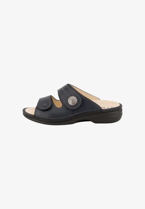 Black open-toe leather slide sandal with two adjustable straps, one featuring a decorative silver button, and a cushioned sole.