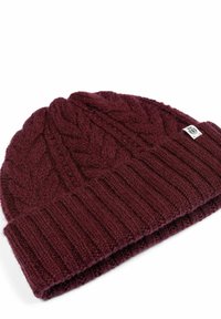 Maroon knitted beanie with a cable pattern at the top and a ribbed cuff. Made of soft yarn, features a small brand tag on the side.