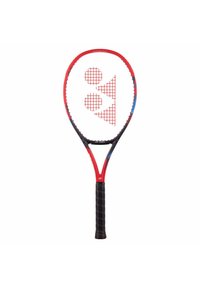 Red and black tennis racket with a rounded head, textured black grip, and a white grid pattern featuring circles and triangles.