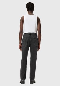 Sorte denimjeans med straight-leg pasform, der har to baglommer og en mid-rise talje. Stoffet har en blød tekstur og en afdæmpet finish.