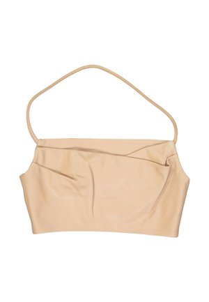 Beige, hihaton crop-toppi, jossa ohuet spagettihihnat ja hieman kerätty yksityiskohta etukankaan kohdalla.