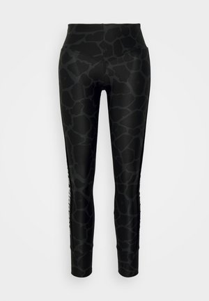 Black leggings with a textured giraffe pattern, high waistband, and white logo detailing on the side. Smooth, stretchy material.