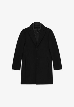 Palton lung pentru bărbați, de culoare neagră, cu trei butoane, rever în treptat și un strat intern din vestă cu fermoar matlasată.