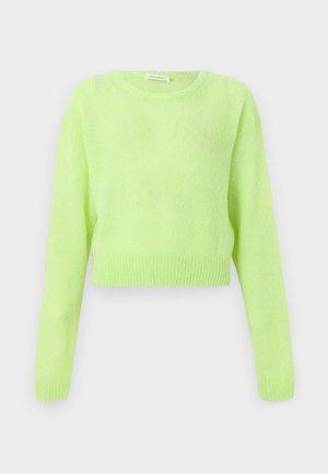 Hele laimeroheline pikkade varrukatega lühikese lõikega kampsun, millel on ümmargune kaelus ning soonilised varrukaotsad ja ääred, ühevärvilisel taustal.