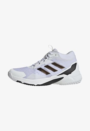 White athletic shoe with a mesh upper, three brown stripes, and a black accent on the sole. Features a cushioned midsole and lace-up design.