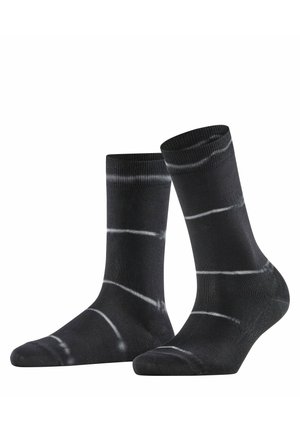 Calzini neri con strisce orizzontali bianche irregolari tie-dye, mostrati in posizione verticale su sfondo bianco.