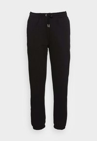 Pantalones de chándal negros de mezcla de algodón, con cintura elástica y cordón, tobillos ajustados y una textura suave.