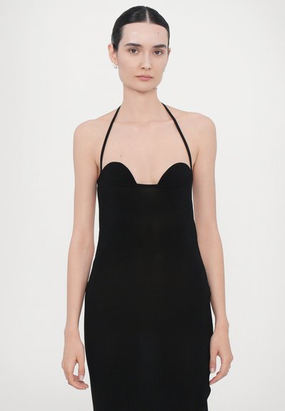 Black halter-neck dress featuring a fitted silhouette, deep sweetheart neckline, and a smooth, stretchy fabric for a sleek appearance.