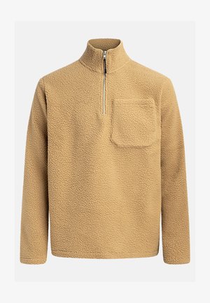 Beige fleece pullover met een hoge kraag, een halve ritssluiting aan de voorkant en een borstzak. Gelaagd stof met een zachte, gezellige uitstraling.