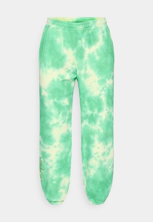 Παντελόνια φόρμας με πράσινο βαφή γραβάτα, μαλακή υφή, ελαστική μέση, στενά μανσέτες και κεντητή λεπτομέρεια με λουλούδια στο αριστερό πόδι.