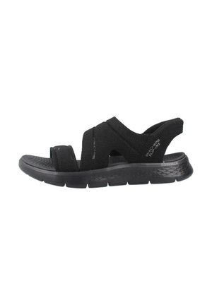 Schwarze Slipper-Sandalen mit elastischen Riemen, gepolsterter Sohle und strukturiertem Außensohle. Einfaches Design, geeignet für lässige Outfits.