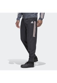 Sorte træningsbukser lavet af let materiale, med tre pink striber på siderne og et Adidas-logo på fronten.