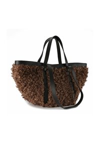 Braune, lockige Tasche mit schwarzen Lederträgern und Akzenten. Weit offenes Design, geeignet zum Tragen verschiedener Gegenstände.
