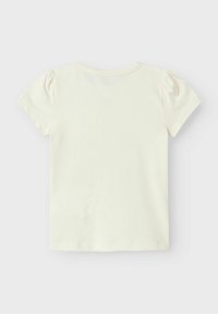 Kortærmet, cremekrave bomulds t-shirt med rund halsudskæring og let puffede ærmer. Glat tekstur og minimalistisk design.