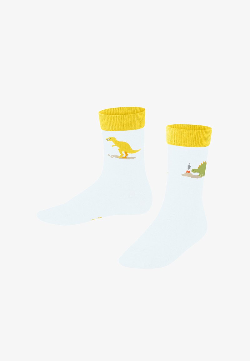 Kinderstrümpfe aus weißer Baumwolle mit gelben Rippenbündchen. Sie verfügen über verspielte Dinosaurier-Muster in Gelb und Grün und haben eine weiche Textur.