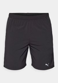  Sorte atletiske shorts lavet af letvægtsstof med elastisk talje. Har et lille hvidt Puma-logo nederst til venstre.