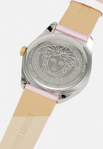 Silver stainless steel watch with a pink leather strap. Features a Medusa design on the back, sapphire crystal, and gold accent on the crown.