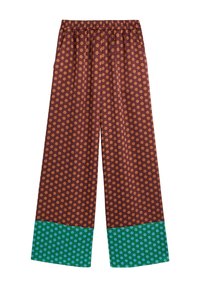 Brązowe spodnie o szerokich nogawkach w pomarańczowe kropki, z tealowym wykończeniem ozdobionym jaśniejszymi niebieskimi kropkami. Elastyczny pas dla wygody.