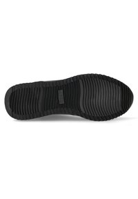 Svart gummi sulor med en texturerad yta som har horisontella och vertikala spår för grepp, samt en central logotyp för varumärket.