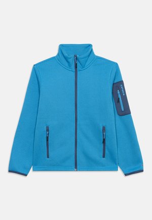 Veste zippée bleu texturée avec col montant, deux poches zippées à l'avant et une poche zippée sur la manche gauche avec un détail de marque.
