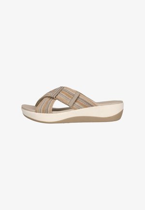 Sandales à plateforme beiges avec un design à brides croisées en tissu texturé, présentant des rayures horizontales couleur brun clair et crème, ainsi qu'une semelle rembourrée.