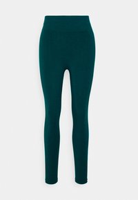 Leggings teal à taille haute, fabriqués en tissu extensible. Présentent une texture lisse et un design ajusté, se terminant à la cheville.