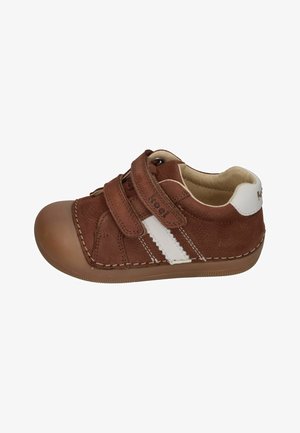 Brown toddler shoe with white side stripes, two Velcro straps, and rubber sole, designed for easy wear and comfort.