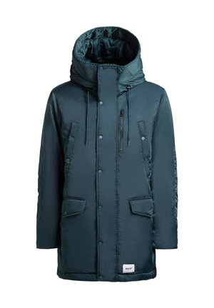 Parka imbottita color teal con un ampio cappuccio, due tasche davanti e una tasca sul petto con zip. Dotata di bottoni a pressione e regolazioni con cordino.