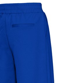 Blue elastic waistband pants with a single horizontal back pocket and smooth fabric texture.