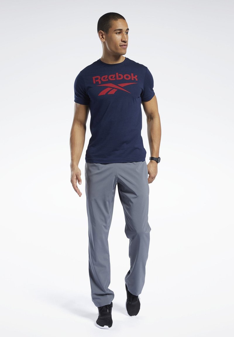 Reebok TRAINING ESSENTIALS WOVEN UNLINED PANTS Tracksuit bottoms grey Zalando.co.uk