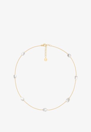 Guld kæde med seks ovale, matte hvide perler. Inkluderer en kæde med lås og en justerbar længde med forlængerkæde.