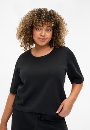 Schwarzes Kurzarm-Top aus weichem Material mit Rundhalsausschnitt. Das Design zeichnet sich durch eine lockere Passform und eine glatte Textur aus.