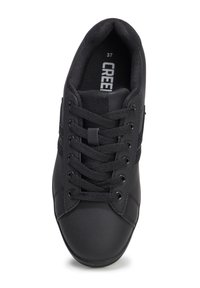 Sneaker nera con tomaia sintetica liscia, punta rotonda e sei occhielli in metallo, dotata di lacci neri e zona cuscinetto alla caviglia. Taglia 37.