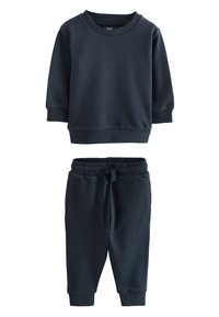 Sweat-shirt en coton bleu marine à manches longues et poignets côtelés, assorti d'un pantalon de jogging avec taille élastique et poches latérales.